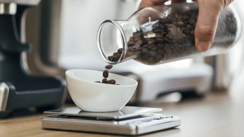 coffee beans being weighed on scale