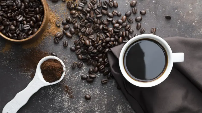coffee with tablespoon, powder, and beans