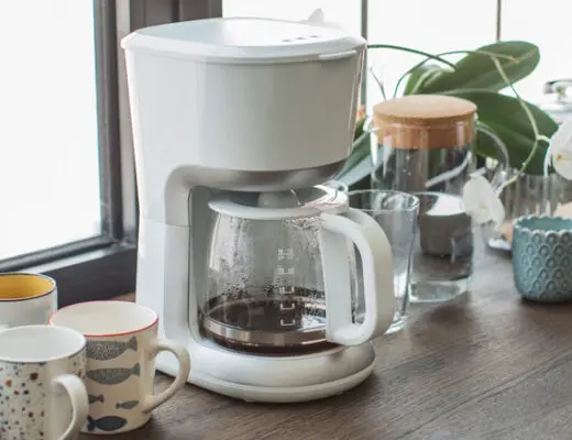 Coffee pot on brown wood counter