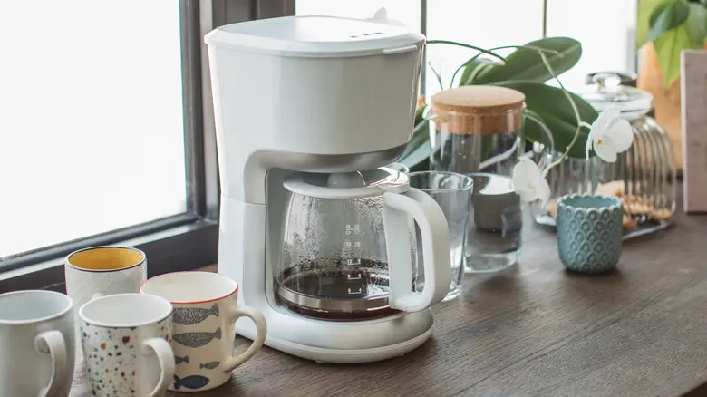 Coffee pot on brown wood counter